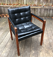 Front three-quarter view showing overall chair design, frame and upholstery