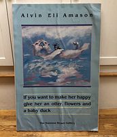 Full view of the sea otter poster with text and artwork visible, mounted on board.