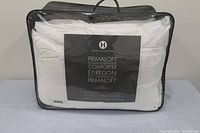 Front of packaged comforter showing brand and product detail