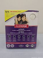 Front view of AllerEase Ultimate mattress protector packaging showing product branding and key features.