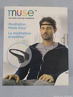 Front of box showing Muse brain sensing headband used for meditation, featuring a man wearing the headband and slogan "Meditation Made Easy".