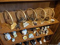 Five Jefferson Golden Hour clocks displayed on a wooden shelf