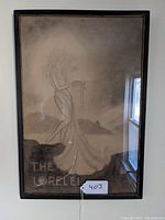 Full view of the framed charcoal or pencil sketch titled 'The Lorelei' showing the woman in profile on a rock with a flowing gown.