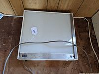 Top view of the GE lighted slide viewbox showing the rectangular illuminated surface and power cord.