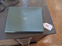 Closed Lenox branded green box for the picture frame.