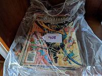 Small stack of vintage Marvel's Greatest Comics starring The Fantastic Four covered in a plastic bag showing colorful comic cover art.