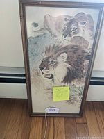 Full view of framed watercolor painting depicting two lions