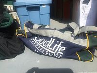 Blue and yellow GoodLife Fitness Clubs branded duffle bag, slightly used