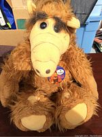 Front view of the 1980s Alf Doll showing plush brown fur, face details, and button.
