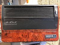 Oreck XL Professional air purifier front view showing woodgrain finish and branded label