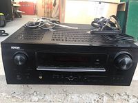 Front view of Denon AVR-1912 receiver with power and volume knobs and input selector