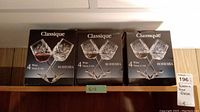 Three black boxes of Classique Bohemia wine glasses each with 4 glasses, totaling 12 glasses.