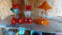 Image showing all three hummingbird feeders on a shelf with note