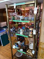 Front view of shelving unit holding decorative items.