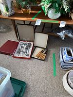Full view of the coffee table showing the top and some items placed on and around it (contents not included in sale).