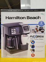 Box of Hamilton Beach FlexBrew Trio Coffee Maker showing image of coffee maker and features.