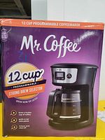 Front view of Mr. Coffee 12 cup programmable coffee maker box highlighting strong brew selector and key features