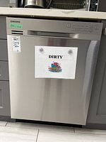 Front view under countertop with DIRTY sign and inventory tag