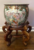 front view of porcelain planter on wooden stand