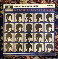Front cover of The Beatles A Hard Day's Night LP showing blue background with 20 black and white photos of the Beatles.