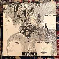 Front cover of The Beatles Revolver LP showing iconic illustrated collage artwork.