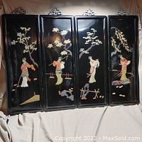 Group photo of all four black lacquered panels with Asian women and tree scenes, arranged side by side on beige fabric background.