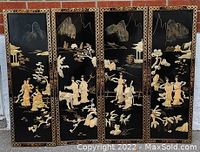 Full view of four decorative panels featuring Asian landscape and figures art in beige on black background with gold patterned borders.