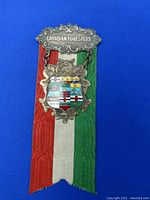 Front view of the Canadian Foresters medal showing detailed provincial crests and the tricolor ribbon.