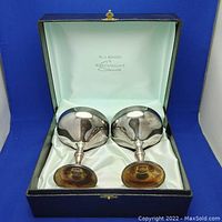 Pair of silver-plated champagne sipper cups in blue lined case