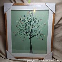 Front-facing view of framed tree print, showing full artwork, mat, frame and packaging