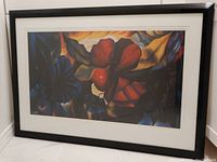 Full view of framed print showing the floral-themed artwork and framing details.