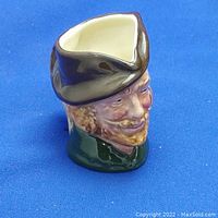 Royal Doulton Robin Hood character jug side profile showing facial features and hat design.