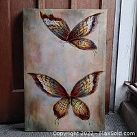 Front view of canvas painting depicting two butterflies on neutral background.