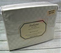 Front view of Andiamo Fine Linens sheet set packaging showing off-white checkerboard pattern, 500 thread count, Egyptian cotton label, queen sheet set.