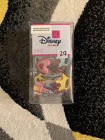 Front view of Disney Princess Rose shower curtain hooks in original clear plastic box, showing various whimsical shapes like hearts and dresses in pastel colors attached to metal hooks.