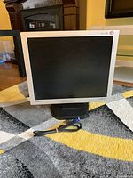 Front view of Samsung 19-inch LCD computer monitor, showing screen and power cable in front.