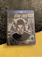 Front of the Star Trek Blu-ray steelbook showing main characters and 2009 movie title.