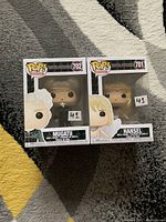 Front view of two Funko Pop Zoolander figures in boxes: Mugatu #702 and Hansel #701, with price stickers visible.