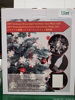 Box for 19 foot Christmas string light with clear white snowflake LED lights and USB power