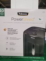 Photo of the product box showing the Fellowes PowerShred 10-sheet cross-cut shredder with product features and branding details.