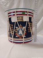 Front view of drum with glass top and ruler showing height approx 12 inches