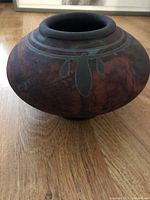 Photo of the Robert Graydon pottery vase showing its shape, color, and painted design details.