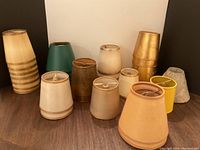 Front-facing group of thirteen assorted lamp shades