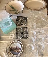 Overview of crystal and glass items including serving platters, plates, glasses, coasters, and salt & pepper shakers