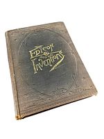 Front angled view of the antique hardcover book showing the cover design, title embossing and general wear