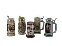 Group photo of five vintage beer steins showing overall design, lids, and decoration.