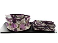Pair of Thirty One insulated food totes displayed on black surface, showing floral purple design and handles.