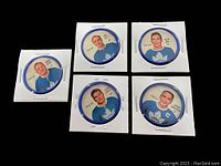 Top-down photo showing all five hockey coins in white card holders. Coins feature vintage portraits of Toronto Maple Leaf players with blue border.