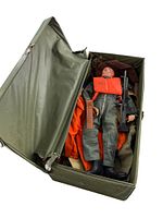 Open green hard case showing the GI Joe figure and various clothing and accessories inside.