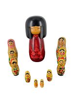 Full view of the Japanese Kokeshi doll with two sets of Russian Matryoshka dolls arranged around it, showing size comparison and all dolls' front details